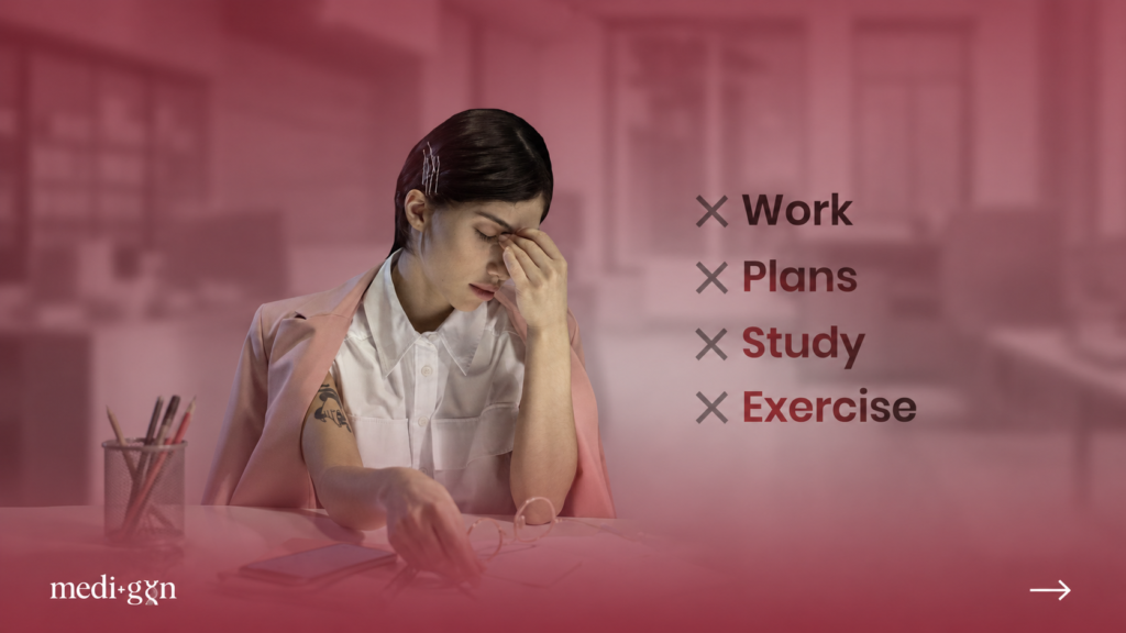 Home Tired woman at her desk experiencing menopause brain fog and fatigue ā Medi-Gyn hormone health