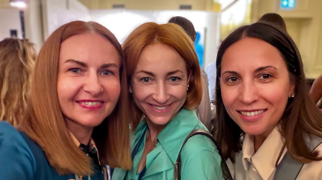 Home Women smiling together at a Medi-Gyn event ā is HRT safe and menopause hormone health