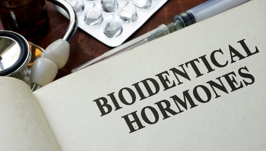 Book with words bioidentical hormones on a table.